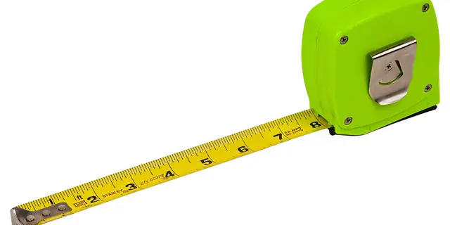 A bright green tape measure pulled out a few inches